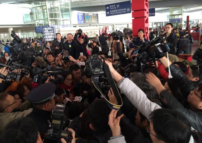 (140308) -- BEIJING, March 8, 2014 (Xinhua) -- Reporters are seen at Terminal 3 of Beijing Capital International Airport in Beijing, China. A Malaysian passenger plane carrying 239 people, including 227 passengers and 12 crew members, has lost contact with air traffic control after leaving Malaysia's capital Kuala Lumpur, the carrier said Saturday. Chinese aviation authorities have confirmed that there were around 160 Chinese nationals aboard the plane. The facility of Beijing Capital International Airport has activated an emergency response system. (Xinhua/Luo Xiaoguang) (cjq)